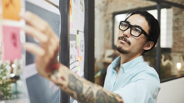 man working on whiteboard