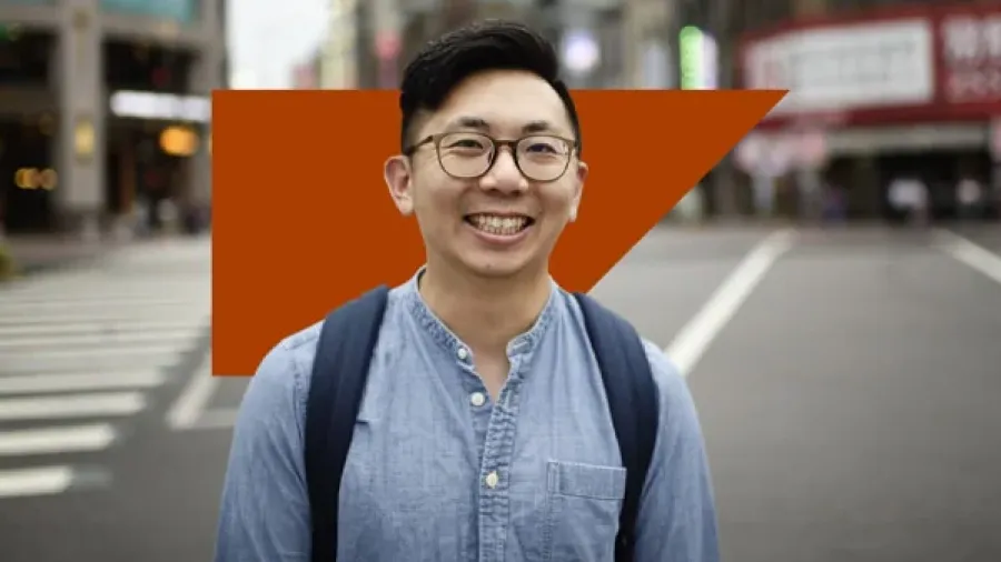 happy man standing looking at camera