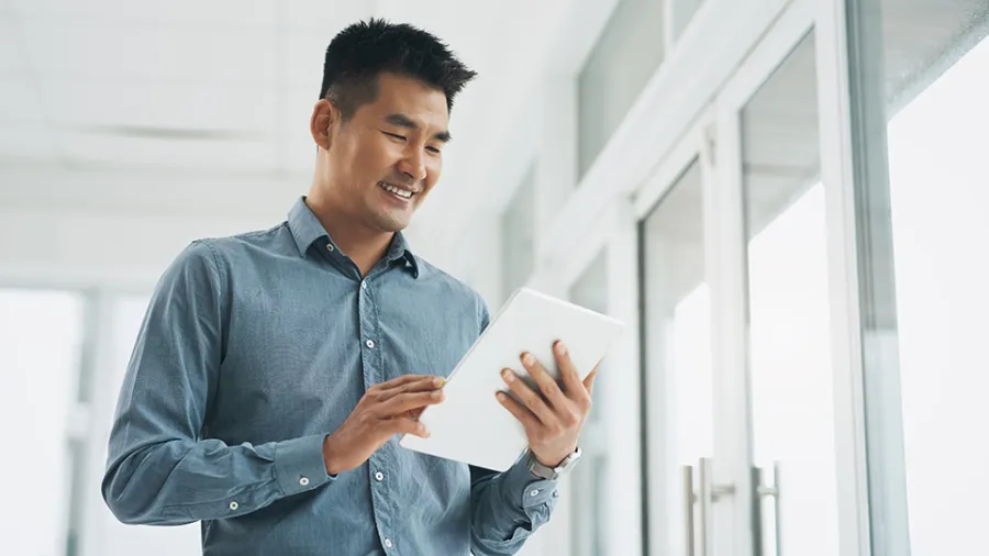 man using tablet with app