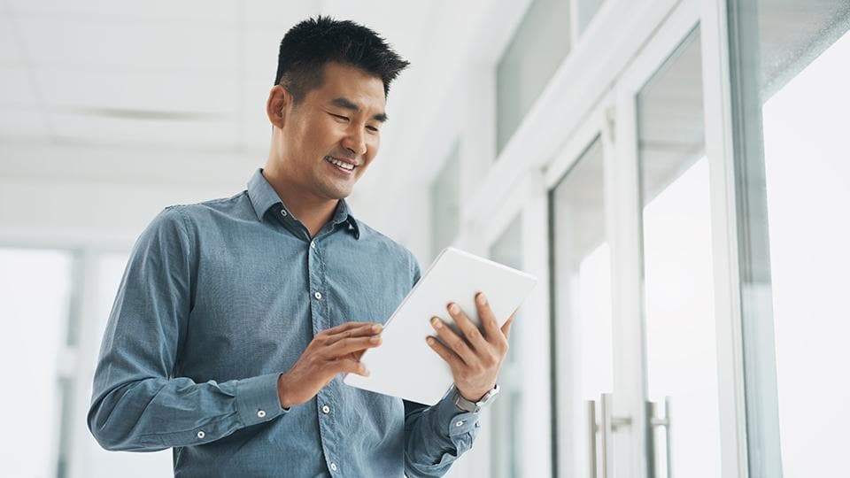 man using tablet with app