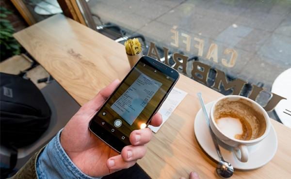 Photo of receipt being taken with phone